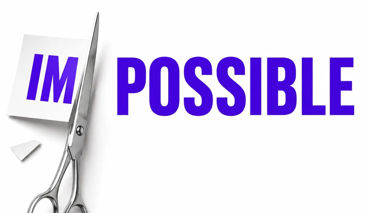 Scissors cutting off the "im" prefix from the word impossible